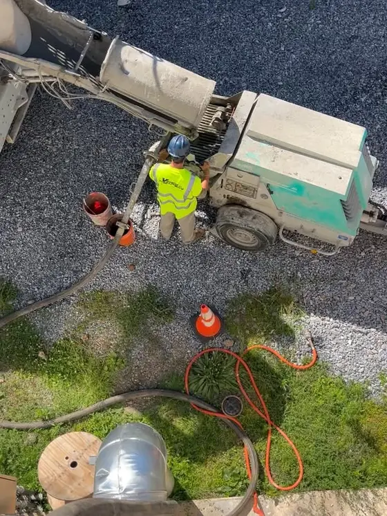 Grout pumped through a 150 ft hose run on a tight-access job